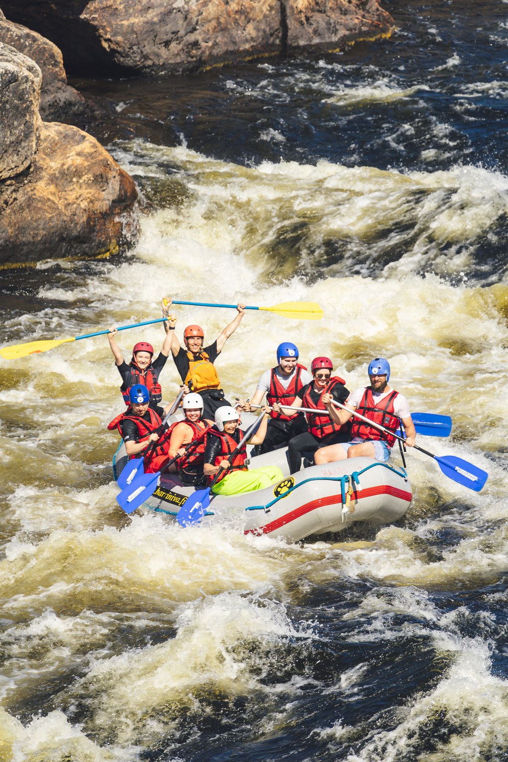 a group of guests enjoying rafting in Muoniojoki river
