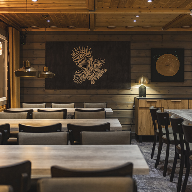 Refurbished Kuukkeli restaurant with modern wilderness design at Harriniva adventure resort in Finnish Lapland