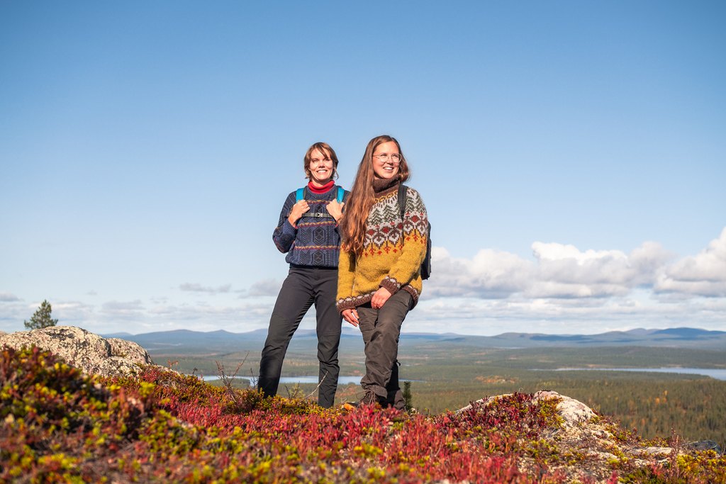 Guests enjoying autumn hike at pallas-Yllästunturi national park in Lapland, Finland