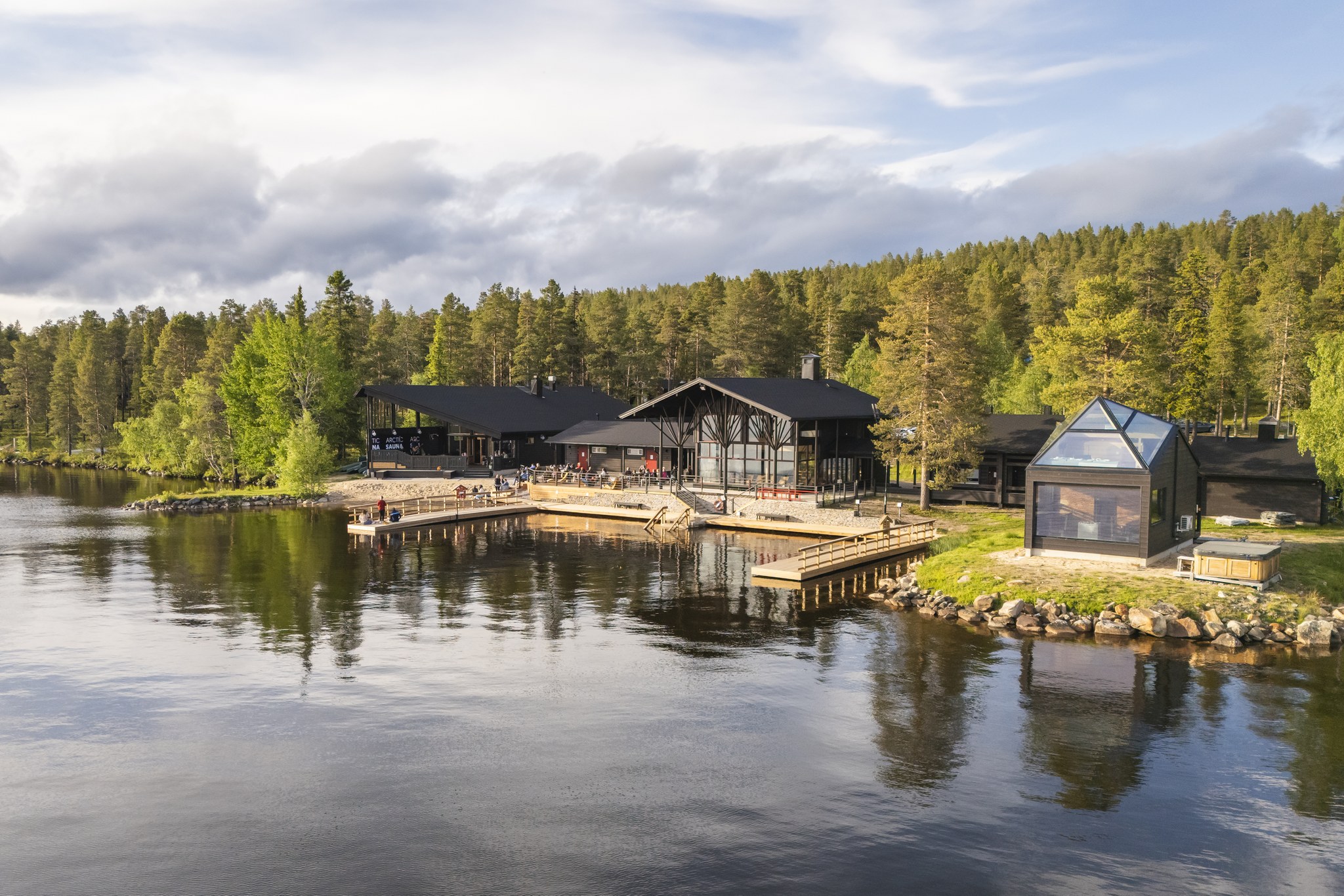 Arctic Sauna World in a beaufitul still summer landscape in Lapland, Finland